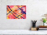 A giclee fine art print with a pink, orange and yellow background which has streaks of white and splatters of blue over the top